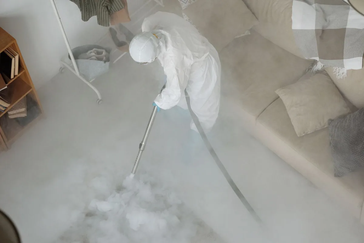 Biohazard cleanup technician in protective equipment, Wakefield, MI